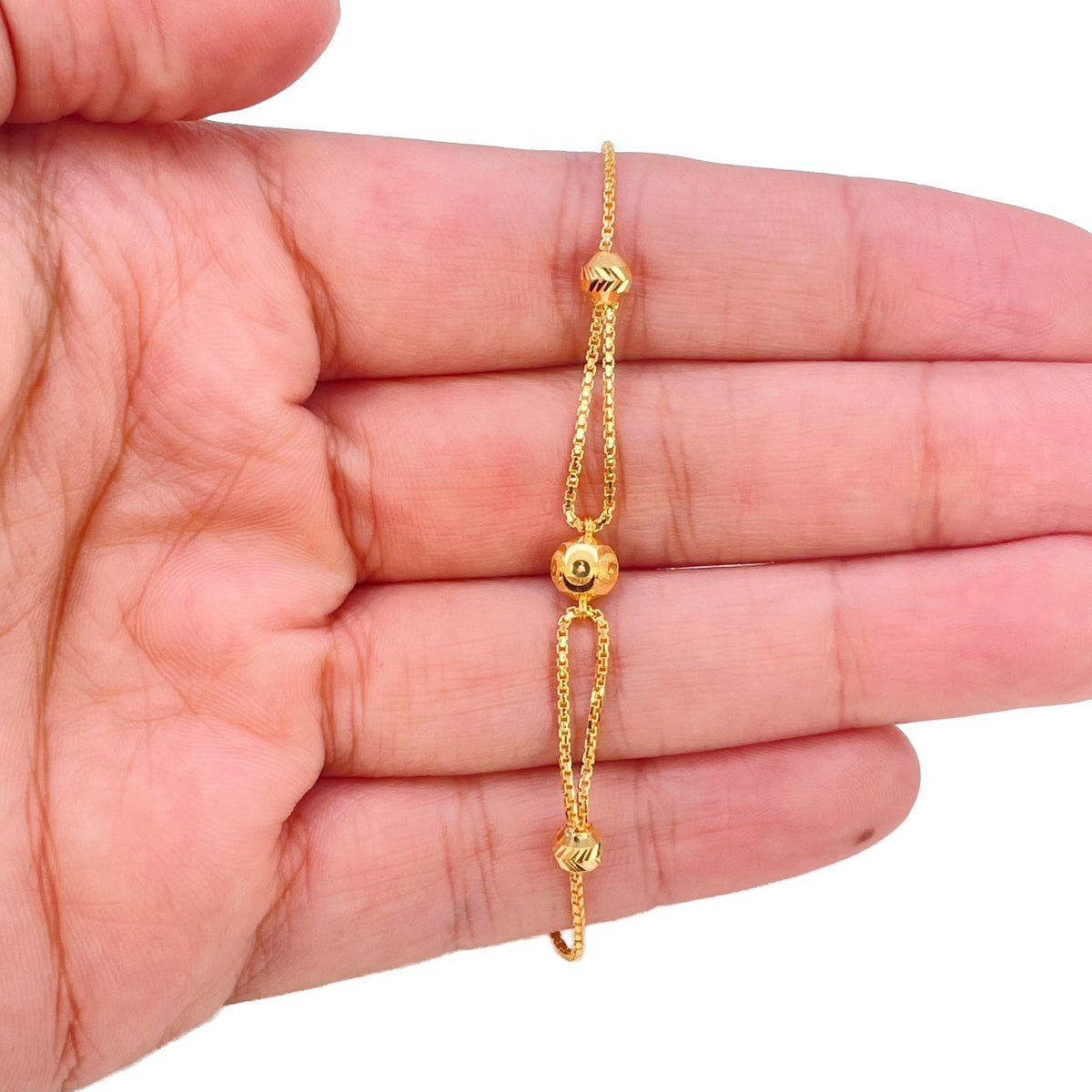 22ct yellow gold dainty bead station bracelet by Raina Jewels, full length view