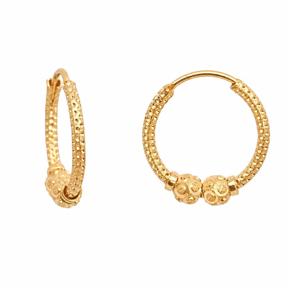 Close-up of 3.9mm diamond cut bead detail on 22ct gold sparkle hoop earring